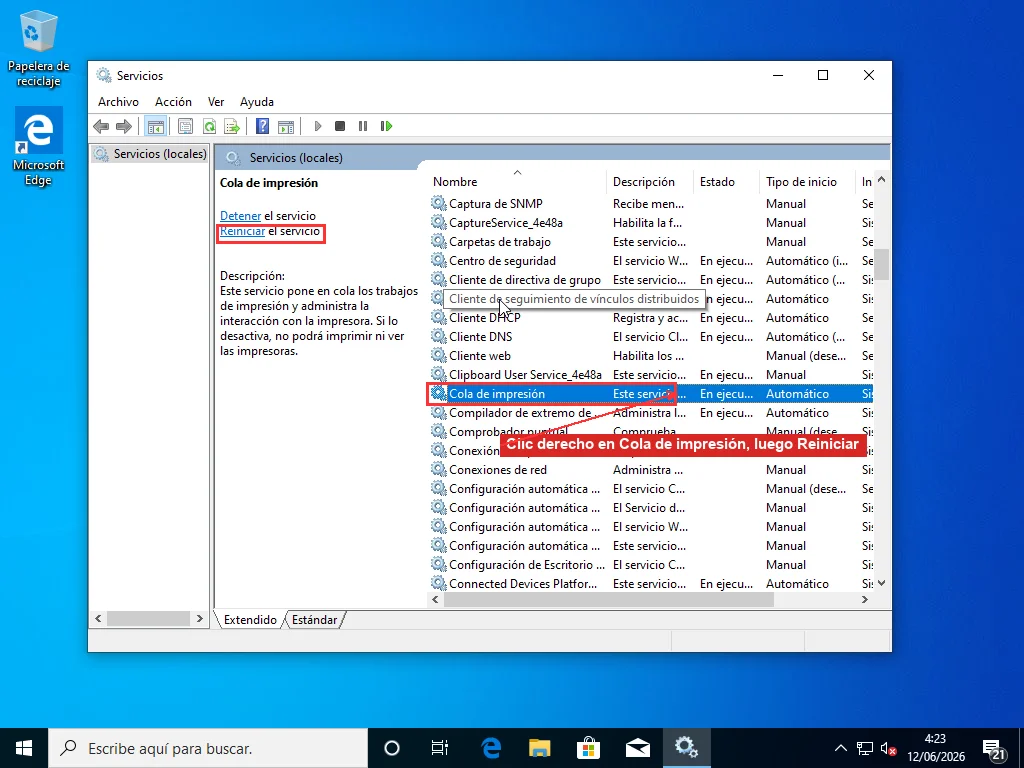 Consola de Servicios de Windows con el servicio Cola de impresión seleccionado y el enlace Reiniciar el servicio visible en el panel izquierdo